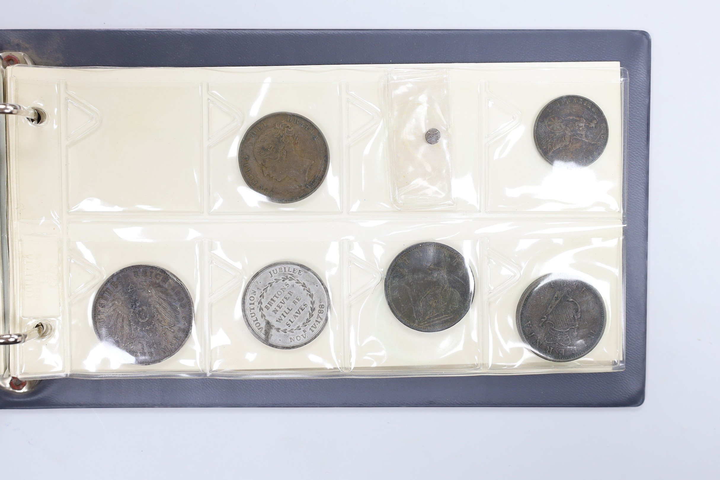 Two albums of UK coins, George III to George VI to include 1921 to 1946 halfcrowns, 1807 penny VF, 1805 Irish halfpenny AVF, a 'Revolution Jubilee 1788' medal etc
